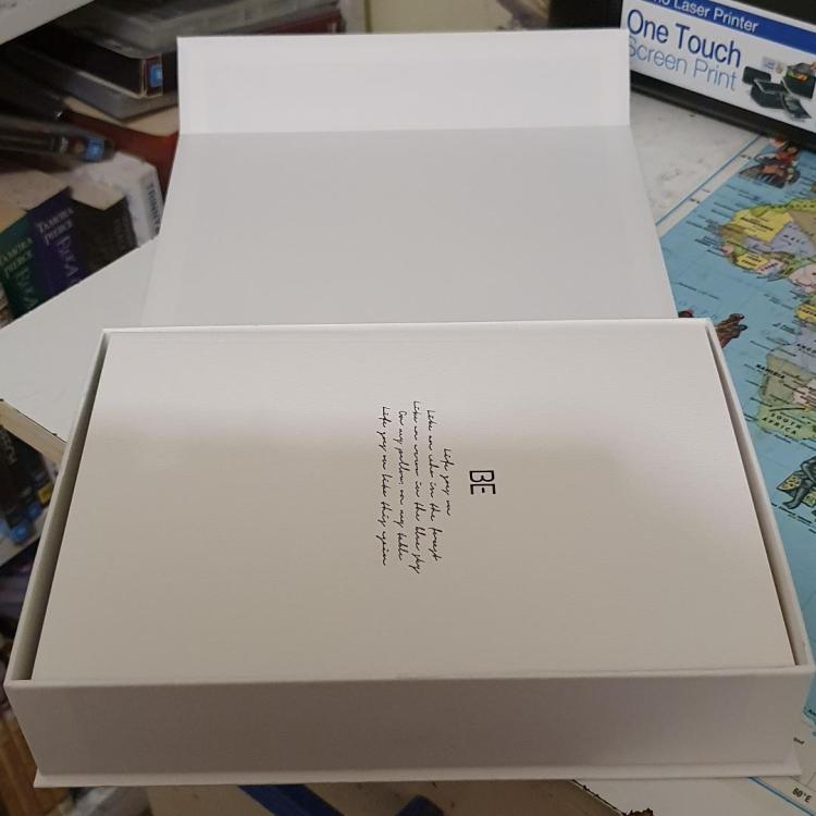 BE album package open